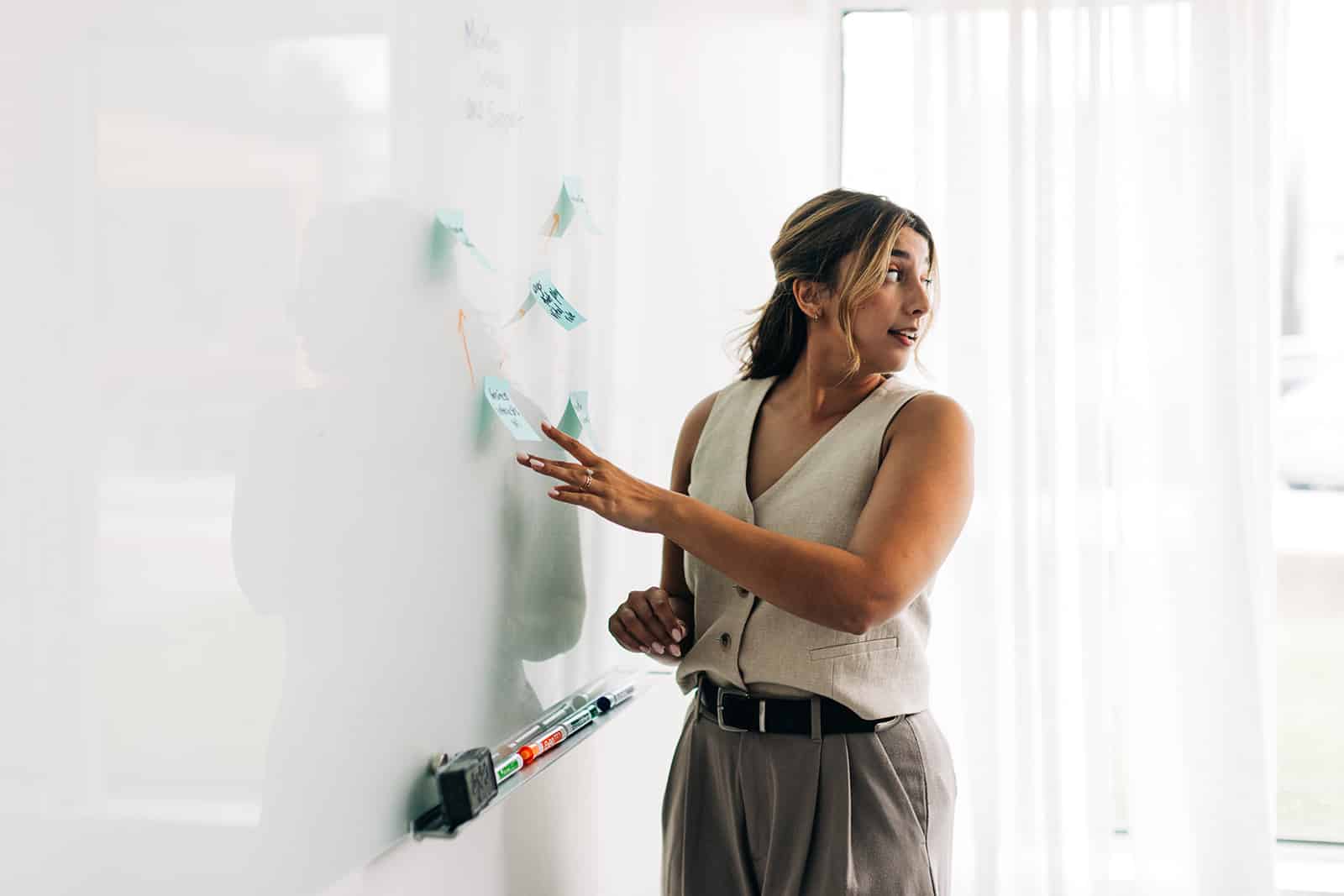 Two men discussing ideas at table.