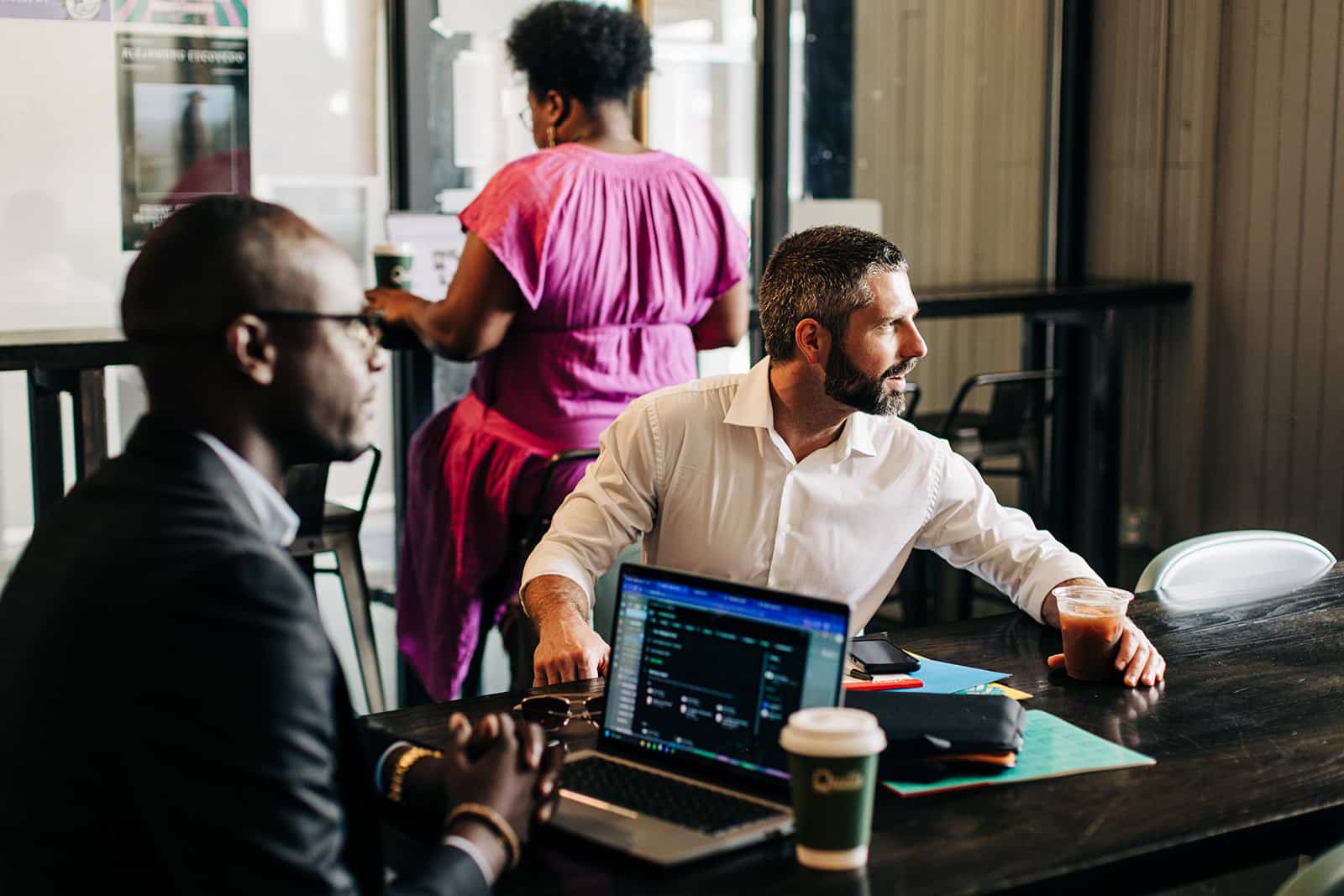 Business meeting in a café setting.